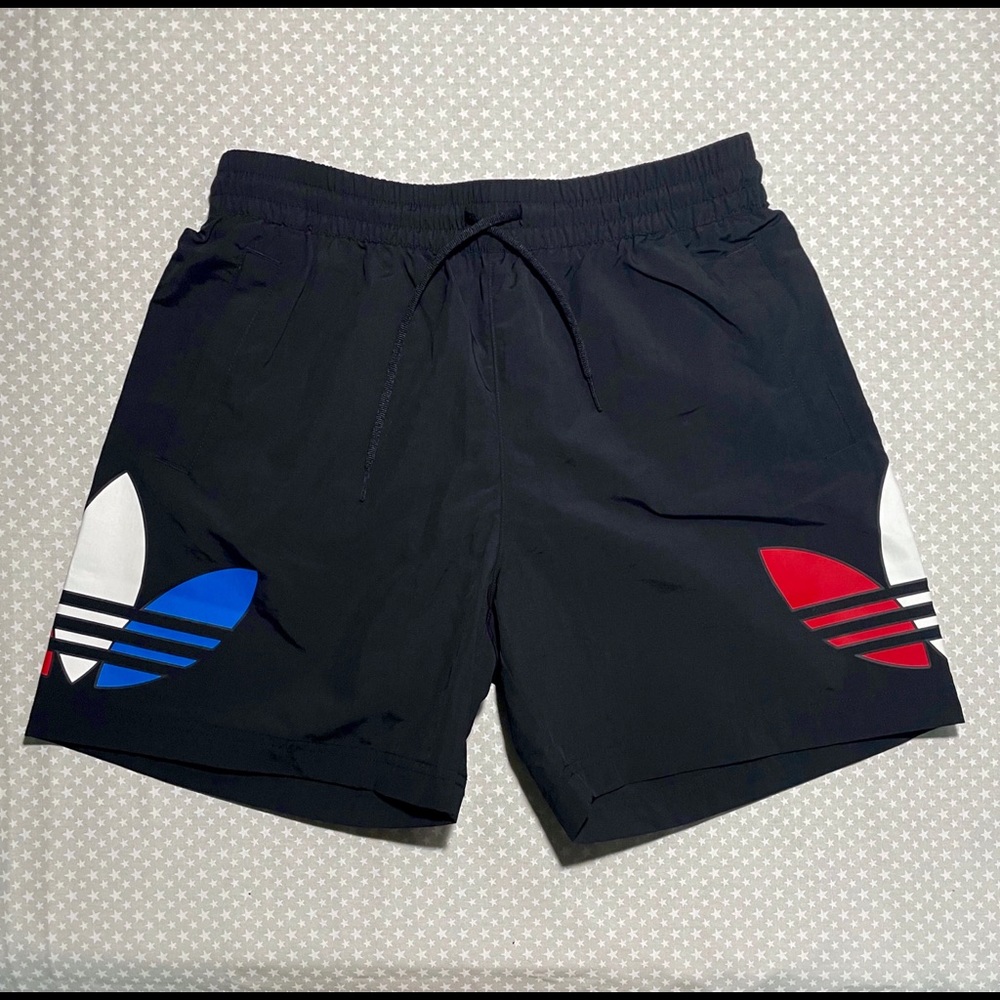 Adidas Black Male Swim Shorts with Red, White, and Blue logos on legs in size S